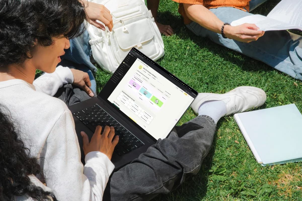 Student studying outdoors on a laptop